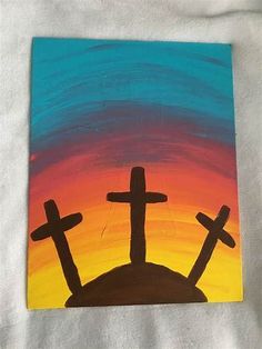 a painting of three crosses on top of a hill