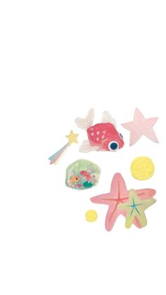 a toy fish, starfish and other toys on a white background