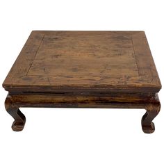 an old wooden coffee table with two legs