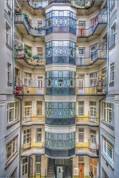 an apartment building with many balconies and windows