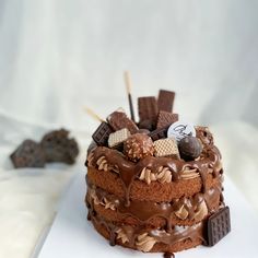 a cake with chocolate frosting and candies on top