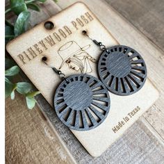 the earrings are made out of wood