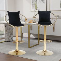 two black and gold bar stools in a living room