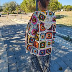 Holiday Gift idea, Christmas Gift, New Year Gift, Unique Handmade Valentine's Days Gift, Gift For Her Birthday, Unique Crochet Hippie Festival Cardigan, Hand Knitted Gift for Her. Multicolor granny square crochet jacket best gift for your loved or yourself🎁. This patchwork hooded cardigan can be a perfect gift for your daughter or your sister.🎁 🧶 This Afghan Coat I knitted with high quality cotton acrylic blend yarns.(55% Cotton, 45% Acrylic) This hand knitted crocheted Boho coat can be worn in any season. MEASUREMENTS: The measurements of the crochet cardigan worn by our woman model in photos : Bust 43.5 inches, Length 28 inches . Arm length from underarm 17.5 inches. (I will knit the sleeve length according to your measurements.) Length of cardigan 25" - 29", Sizes from 35" to 58". 💝 Handmade Casual Winter Outerwear, White Hooded Cardigan For Spring, Cream Crochet Outerwear For Winter, Handmade White Long Sleeve Outerwear, Winter Cotton Crochet Outerwear, Winter Crochet Cotton Outerwear, Casual Multicolor Outerwear With Granny Square, Winter Cotton Cardigan With Granny Square, White Granny Square Sweater For Winter