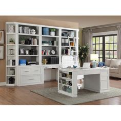 a white desk and bookcase in a room