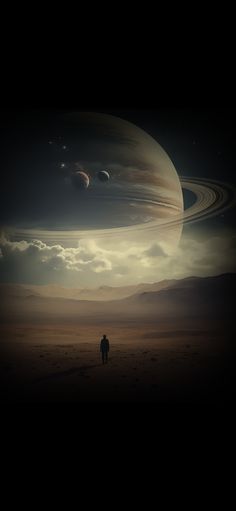 a man standing in the middle of a desert under a sky filled with saturn like objects