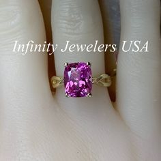 "This ring is an elongated cushion cut lab created pink sapphire solitaire, 14k yellow gold #6365 We feature the finest quality lab grown sapphires in the world. The properties of lab-grown are physically, chemically and visually identical to natural, just grown in a lab setting. -Approximate total carat weight: 3.20ctw diamond equivalent -Center Stone Size: approx. 3.20ct diamond equivalent -Center Stone Shape: cushion cut 10x8mm -Gem Type: lab created pink sapphire -Stone Clarity: VS2 -Stone C Pink Cushion Cut Ring For Anniversary, Pink Rectangular Jewelry For Anniversary, 14k Gold Cushion Cut Sapphire Ring For Anniversary, Cushion Cut Pink Sapphire Rings For Anniversary, Formal Pink Cushion Cut Ring, Purple Cushion Cut Brilliant Ring, Pink Sapphire Cushion Cut Rings For Anniversary, Classic Pink Radiant Cut Jewelry, Pink Sapphire Cushion Cut Rings