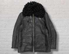 PLEASE READ BEFORE BUY!! THIS IS USED CLOTHING PLEASE DON'T EXPECT IT TO BE LIKE NEW OR IN PRISTINE CONDITION Limited Edition GUCCI Vintage Clothing Lambskin Leather Shearling Fur Lining Black Color Zipper Belt 46 Size Jacket. Brand: Gucci. Made in: Italy. Material: 100% lambskin leather & fur. Tag size: 46 Measurement: -Chest: 22" (55.9 cm). -Length: 29" (73.7 cm). -Shoulders: 19" (48.3 cm) -Sleeve length: 24" (61 cm). Condition: Used. Good vintage condition.   Small defect on zip stopper but not affected it's use (refer picture). Payment: Optional payment available. Ordered item will be sent within 3-5 days after payment is completed. Shipping: ASAP by DHL Express or FedEx with 5-10 days ETA worldwide. ATTENTION : Please pay close attention to measurements provided. Do not rely on tag si Used Clothing, Lambskin Leather, Black Color, Vintage Gucci, Like New, Vintage Outfits, Zipper, Jackets & Coats, Sleeve Length