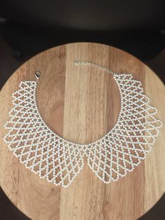 Pearl beaded bib necklace Beaded Flowers Patterns, Beaded Bib Necklace, Crochet Bedspread Pattern, Beading Netting, Geek Jewelry, Seed Bead Patterns, Cross Stitch Patterns Flowers, Beaded Jewelry Tutorials, Handmade Jewelry Tutorials