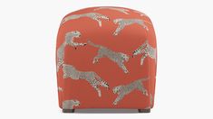 an orange suitcase with giraffes on it