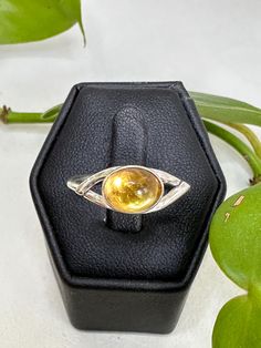 Sterling silver golden citrine ring. This stone is oval shape in a bezel setting. Oval Yellow Citrine Birthstone Ring, Oval Cabochon Citrine Rings, Oval Citrine Birthstone Ring, Oval Amber Topaz Ring, Oval Cabochon Topaz Ring For Anniversary, Amber Birthstone Ring, Formal Oval Cabochon Topaz Ring, Anniversary Oval Cabochon Topaz Ring, Yellow Oval Crystal Gemstone Ring