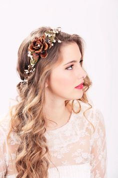 a woman with long hair wearing a flower in her hair