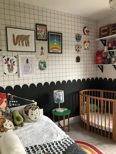 a child's bedroom with black and white walls