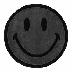 a black rug with a smiley face on it