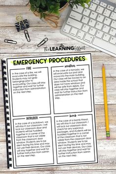 an emergency procedure is shown on top of a desk next to a keyboard and pen