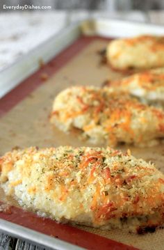 some food that is laying on a baking sheet and ready to be cooked in the oven