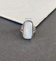 Rainbow Moonstone Silver Ring, 925 Sterling Silver Rectangle Shape Gemstone Ring, Designer Handcrafted Ring, Engagement Ring, Gift Idea Description Metal :- 925 Sterling Silver Style : Band Gemstone:- Rainbow Moonstone  Benefits Of Rainbow Moonstone  Rainbow moonstone is thought to bring balance, harmony and hope while enhancing creativity, compassion, endurance and inner confidence. Rainbow moonstone is believed to help strengthen intuition and psychic perception, especially offering us visions Adjustable Silver Hallmarked Moonstone Ring, Spiritual Nickel-free Moonstone Ring, Gift Sterling Silver Nickel-free Moonstone Ring, Silver Multi-stone Moonstone Ring In Spiritual Style, Moonstone Benefits, Pink Stone Rings, Nickel-free Sterling Silver Spiritual Crystal Ring, Gemstone Ring Silver, Green Gemstone Ring