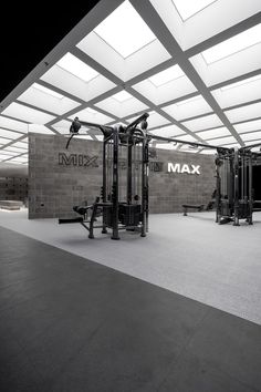 an empty gym with equipment in the middle