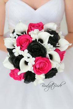 the bride's bouquet was made up of black, white and fuchsia flowers