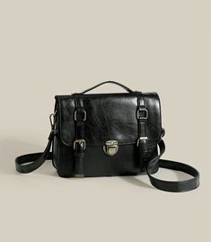 Classic vintage inspired satchel bag with a push-buckle and magnetic buckle strap closure. Carry it in your hand or wear it as a crossbody. Crafted from PU leather. Main compartment has a zip. Big enough to fit an iPad. 31cm width x 23cm height x 8cm thickness12.2" width x 9.05" height x 3.15" thickness Leather Satchel Shoulder Bag With Turn-lock, Classic Brown Satchel With Turn-lock Closure, Brown Rectangular Satchel With Buckle Closure, Vintage Satchel Shoulder Bag With Turn-lock Closure, Brown Leather Satchel With Turn-lock Closure, Shoe Gifts, Sweater Blouse, Cardigan Jacket, Satchel Bags