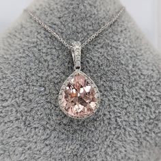 Pear-shaped Morganite Jewelry, Pear-shaped Pink Diamond Jewelry, Diamond Teardrop Jewelry With Accent Stones, Pink Teardrop Jewelry With Center Stone, Classic Pink Drop Jewelry, Pear-shaped Morganite Gemstone Jewelry, Pear-shaped Diamond Jewelry With Accent Stones, Wedding Pear-shaped Necklace With Halo Setting, Pear-shaped Necklace With Halo Setting For Wedding