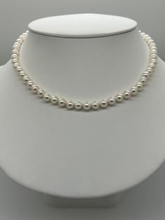 White Akoya Pearl Necklace.   This hand knotted necklace features 60 White Japanese Akoya Pearls AAA High Luster Round rose overtones 6.5 to 7mm.  I hand knotted these with white silk thread and finished them with a 14K Yellow Gold round corrugated bead clasp 7mm.  The necklace measures 17 1/4 inches in length.  The Pearls are Genuine and natural in color.  This is a beautiful classic strand of pearls that can be worn for any occasion.  The necklace pictured is the one you will receive.  The necklace will arrive in a nice presentation box with a Certificate of Authenticity.  Please visit our shop for more pearls and gemstone jewelry. Formal White Hand-strung Jewelry, White Hand Knotted Jewelry With Round Beads, Hand-strung White Pearl Necklace For Wedding, White Hand-strung Necklaces For Wedding, White Hand-strung Wedding Necklaces, Hand Knotted White Round Bead Jewelry, White Pearl Hand-strung Necklaces, White Hand-strung Pearl Necklaces, White Hand Knotted Necklace Gift