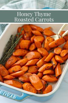 Honey thyme roasted carrots in a serving dish with two spoons and fresh thyme. Carrots With Thyme, Roasted Carrots With Mint, Homey Roasted Carrot, Honey Rosemary Carrots, Roasted Thyme Carrots, Honey Thyme Roasted Carrots, Roasted Baby Carrots, Zucchini Fries, Cheesy Potatoes