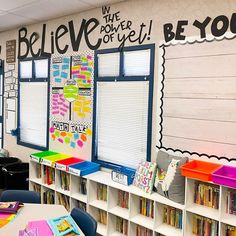 an empty classroom with lots of books on the shelves