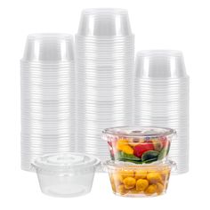 plastic cups with lids are stacked on top of each other