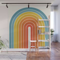 an abstract rainbow wall mural in a living room