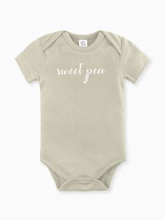 100% Organic cotton infant bodysuit in our Sweet Pea print. Tykes Corner uses certified organic baby clothing so Moms can feel at ease knowing our clothing is free of harmful chemicals and dyes. Sized 0-3, 3-6, 6-12, 12-18 months. Machine wash cold / Tumble Dry Low Remember to support small on your baby registry! Copy and paste the link or click on the Etsy icon in your Babylist app and search Tykes Corner. Need a gift set? You will be a hit at the baby shower!! https://www.etsy.com/shop/tykesco Organic Cotton Short Sleeve Bodysuit For Spring, Basic Cotton Short Sleeve Bodysuit For Summer, Fitted Short Sleeve Organic Cotton Bodysuit For Summer, Soft Fitted Cotton Onesie, Fitted Short Sleeve Bodysuit In Organic Cotton For Summer, Basic Cotton Onesie For Spring, Unisex Cotton Short Sleeve Bodysuit For Spring, Spring Casual Organic Cotton Bodysuit, Fitted Casual Organic Cotton Bodysuit