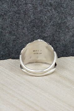 This onyx and sterling silver ring was made by Navajo silversmith Max Calliditto. The inside is signed Max C and stamped sterling.Size: 11.5Length: 3/4"Width: 3/4"Free shipping on all orders! We ship with USPS and always include tracking. All orders ship within a day of payment.Returns are accepted up to 30 days after you receive your order. Just send us a message. Our shop offers cash back or store credit. The item must be returned in new condition. Artisan Engraved Ring Stamped 925 For Anniversary, Artisan Stamped Rings For Anniversary, Sterling Silver Stamped Turquoise Ring Gift, Gift Turquoise Sterling Silver Ring, Sterling Silver Inlay Ring For Anniversary, Untreated Silver Turquoise Ring For Anniversary, Artisan Sterling Silver Engraved Ring For Anniversary, Southwestern Style Rings With Polished Finish, Silver Stamped Turquoise Ring Gift