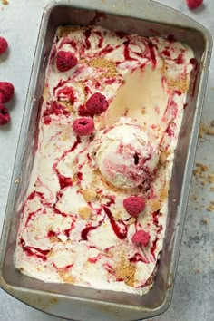 an ice cream dish with raspberries in it