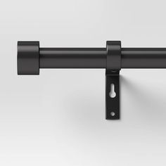 an image of a black metal curtain rod