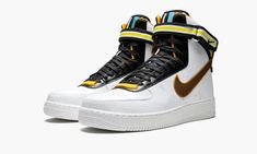 The Nike Air Force 1 gets an update for this bold collaboration with Italian fashion designer Riccardo Tisci.  The Air Force 1 Hi SP Tisci features a modified design by Tisci with an extra high top and added paneling with striped motifs.  The head-turning sneaker is crafted in premium white leather, with an ankle strap featuring woven polyester webbing.  The shoe’s tongue is accented with colorful overlays, while multicolor details also appear on the heel branding.  A full-grain leather Swoosh i Riccardo Tisci, Kicks Shoes, Stadium Goods, Graphic Apparel, Italian Fashion Designers, Nike Air Force 1, White Shoes, Air Force 1, Full Grain Leather