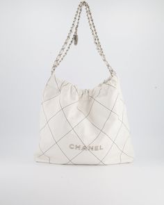 for more information on this item Brand - Chanel Hardware - Silver Model - 22 Bag Colour - White Material - Aged Calfskin Accompanied by the original box ,Sellier dustbag(this is a new Chanel model with the RFID chip and no) and Entrupy Measurements – 39cm x 42cm x 8cm Series - JG4P4U04 Ref - 023835 Delivery 5-8 or 10-15 working days Please note that during high season and Sale period, delivery times may be affected We accept payment with a Credit card, Debit card, or PayPal.Note: Our Items are totally New High quality Brand Inspired Refurbished. Please make sure you are well aware of it before buying any of the Item. T&C's Apply in case of refunds.Please send us message on below chat to confirm availability. We will send the Refurbished Model in case you place an order with us. Enjoy Shop Luxury White Soft Leather Bag, Everyday Luxury White Bags With Leather Lining, Luxury White Bags With Leather Lining, Designer Square Bag In Textured Leather, Designer Square Bags In Textured Leather, Designer Textured Leather Square Bags, Designer White Soft Leather Bag, Designer Square Textured Leather Bag, Designer Cream Bag With Leather Lining