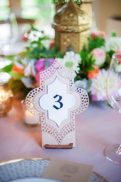 the table is set up with flowers and candles