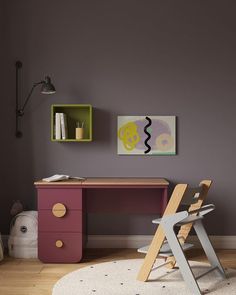 a child's desk and chair in the corner of a room with purple walls