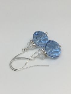 "12x10mm Light blue sapphire faceted crystal glass silver plated brass earrings the length with the hook is 1.25\". Hand made jewelry! All purchase will arrive in gifts boxes. Thanks for stopping by!" Blue Sterling Silver Earrings With French Hook, Sterling Silver Blue French Hook Earrings, Nickel Free Blue Crystal Earrings, Nickel-free Blue Crystal Earrings, Blue Czech Glass Crystal Earrings With Ear Wire, Blue French Hook Jewelry As Gift, Blue Crystal Earrings With Faceted Beads As Gift, Blue Crystal Earrings With Lever Back For Gift, Blue Sterling Silver Crystal Earrings