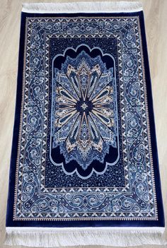 - Prayer rug for Muslim prayer: This prayer rug is carefully handmade with traditional techniques to ensure the highest quality for your prayer needs. - Islamic gift for any occasion: Whether it's for a religious holiday, wedding, or any other special occasion, this prayer rug makes a meaningful and thoughtful gift for any Muslim friend or family member. - Soft and comfortable prayer mat for daily use: Made with soft and durable materials, this prayer mat offers a comfortable surface for daily p Islamic Wall Decor, Prayer Mat, Muslim Prayer, Christian Prayers, Prayer Rug, Islamic Gifts, Bamboo Silk, Silk Rug, Quiet Time