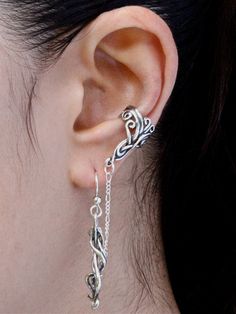 This solid sterling silver Arabesque Bajoran Ear Cuff can be worn on either ear. The Arabesque ear cuff is connected to a Wave Drop earring by a figero chain. One standard piercing is required to wear this ear cuff and earring combination. This graceful design is both elegant and trendy. This listing includes a single Spiro Drop Swirl Earring as well as the Arabesque Bajoran Ear Cuff. Our ear cuffs require no piercings. The ear cuffs slip on the side edge of the ear's cartilage. Slide the ear cu Unique Sterling Silver Cartilage Earrings, Silver Clip-on Ear Cuff Gift, Unique Silver Pierced Ear Cuff, Bohemian Silver Single Ear Climber, Silver Bohemian Single Ear Climber, Bohemian Style Silver Single Ear Climber, Unique Silver Drop Cartilage Earrings, Unique Sterling Silver Cartilage Earrings With Ear Wire, Silver Dangle Ear Cuff With Matching Earrings