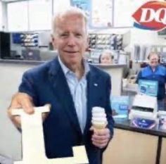 an older man holding up a cupcake and ice cream cone in front of him