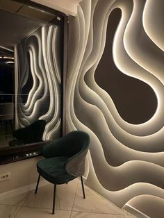 a chair sitting in front of a mirror next to a wall with wavy lines on it