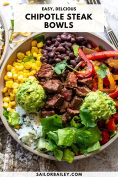 a bowl filled with steak, beans and veggies