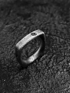 Minimalist roughness. Raw, pure and edgy surfaces with a strong and grunge look & feel. A fully handmade process make every piece unique, no ring will have the same texture. Forged with sand and fire, your ring will reflect your unique souls. A black zirconia stone is encrusted on the ring as symbol of strength. Dare to wear it, dare to be you.MATERIALS:Textured, oxidized and heavy brushed 925 sterling silver .Black cubic zirconia stone.Each piece is made and finished by hand, for this reason ev Forged Ring, Brutalist Ring, Grunge Ring, Brutalist Jewelry, Rough Jewelry, Symbol Of Strength, Russian Roulette, Oxidized Silver Rings, Fire Ring