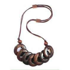 This wooden necklace is made of Sonokeling wood. beautifully made....very suitable for everyday use. can be combined with batik clothes, which will add to the ethnic impression. There are 2 models: - donuts - leaves necklace size: - the length of the rope around = 60 cm (with adjustable rope ) Here's the link for the batik shirt shown in the picture: - https://www.etsy.com/listing/1020498263/summer-blouse-indonesian-batik-blouse -https://www.etsy.com/listing/1036370795/batik-tank-top-tropical-co Unique Brown Fair Trade Necklace, Adjustable Brown Wooden Necklaces, Bohemian Round Natural Necklaces, Bohemian Wooden Necklace For Gift, Bohemian Wood Necklace For Gift, Bohemian Wood Necklace As Gift, Bohemian Wood Necklaces Perfect For Gifts, Bohemian Wood Necklace Perfect As A Gift, Natural Wooden Bohemian Jewelry