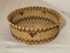 a woven basket sitting on top of a table