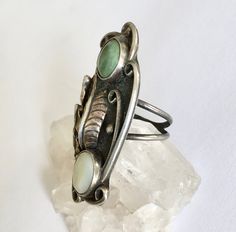 "an amazing and amazingly tall southwestern ring, artisan-made. top stone looks like a green turquoise, bottom one is a mother-of-pearl. beautiful feather and details, nice condition. marked with a stamping on the back. has a fair amount of patina but not much in the way of wear. mother-of-pearl shows some surface wear. size: 5.75 height of face: 1 and 15/16\" width of face: a bit over 13/16\" width of inner band: a bit over 1/16\"" Gold Diamond Band, Vintage Turquoise, Pinky Ring, Green Turquoise, Green Stone, Perfect Ring, Diamond Bands, Turquoise Ring, Silver Fashion