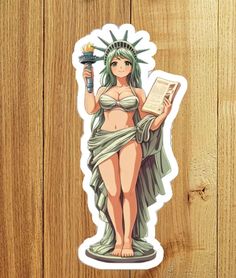 the statue of liberty sticker is shown on a wooden surface