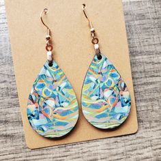 This pair of lightweight, teardrop earrings adds a unique touch, featuring original neuro-inspired artwork. They are artsy, vibrant and a creative way to advocate for healthy thought patterns. A unique accessory for anyone needing a gentle reminder, but also eye-catching jewelry for those in neuroscience, counseling or medical professions. If you are interested in the original artwork that inspired this item or seeing more from the art collection, visit Geinene.com or follow me on Instagram @Geinene .: Made from lightweight, MDF wood 1.6 inches .: Sturdy, chip-free coating keeps printed design vivid .: Image printed and transferred to both sides of earring .: Each earring assembled weighs only 2g .: Earring hook comes in silver or rose gold .: Sterling Silver .925 hooks available upon dire Artsy Blue Teardrop Earrings, Artsy Green Teardrop Earrings, Unique Hypoallergenic Teardrop Earrings, Multicolor Hypoallergenic Teardrop Earrings As Gift, Artistic Teardrop Earrings With Artistic Design, Artistic Teardrop Earrings, Artsy Teardrop Earrings With Ear Wire, Multicolor Teardrop Earrings For Gift, Multicolor Teardrop Pendant Earrings For Gift